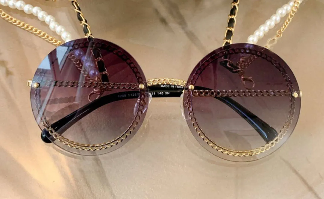 Okrągłe okulary przeciwsłoneczne czarny szampan złoty łańcuch bez krawędzi kobiety mody okulary przeciwsłoneczne z pudełkiem274n