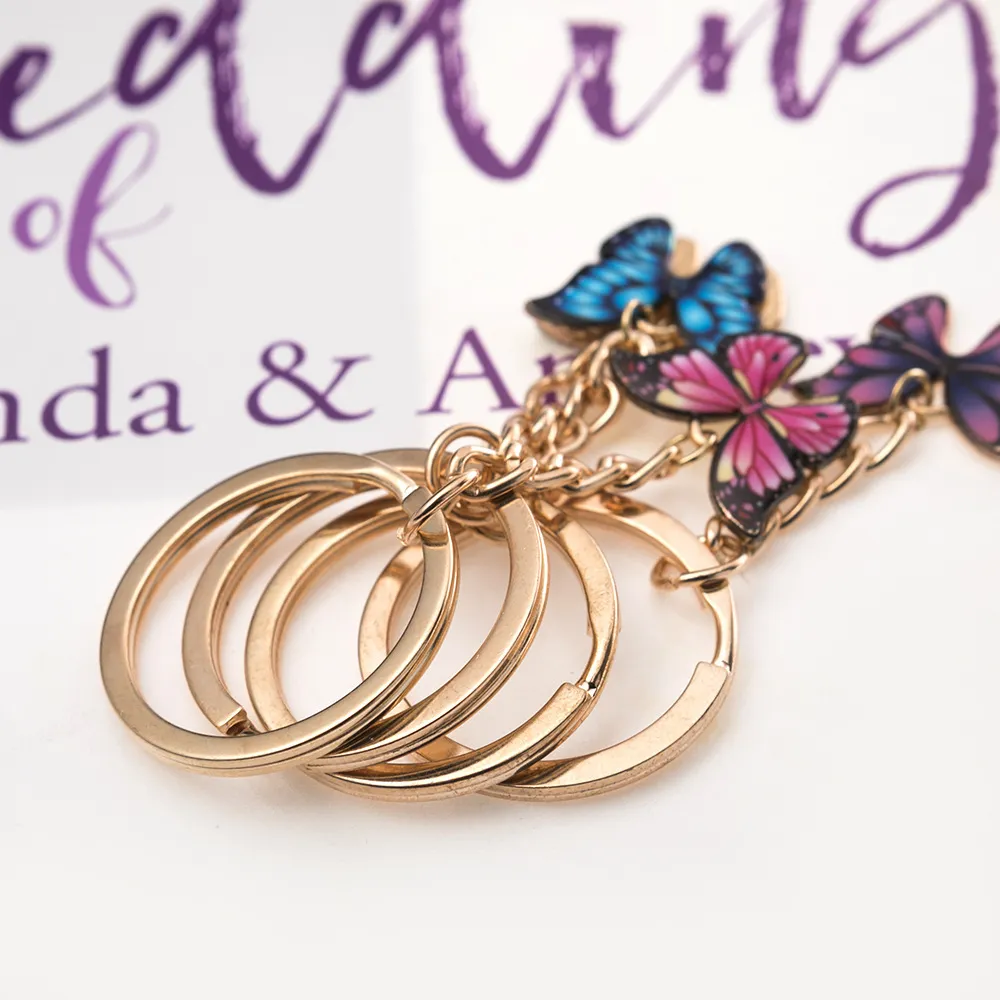 Dubbel färgglada fjäril nyckelring ringhållare charm mode enkel insekt nyckelring väska hängsmycke smycken