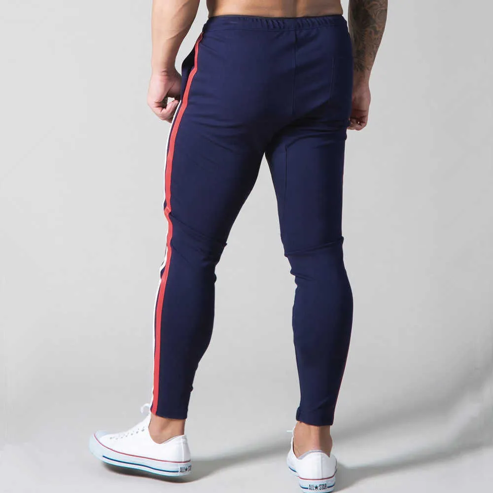Białe jogger dresspants Men swobodne chude bawełniane spodnie siłowni trening fitness Spodnie męskie Spring Sportswear Pants P08245T
