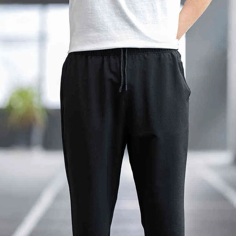 Hommes été printemps mode décontractée séchage rapide respirant couleur unie pantalon mâle léger rue Fitness Joggers pantalon 211112