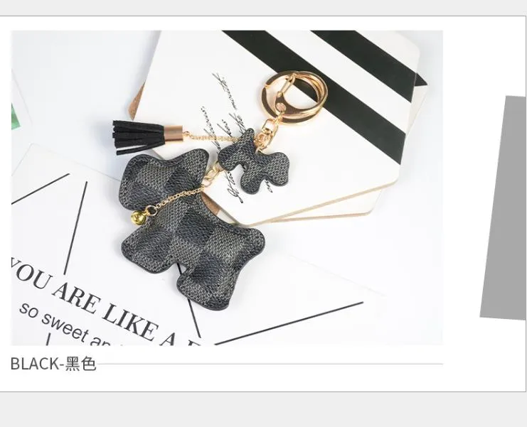 Fabricant approvisionnement direct porte-clés créatif petits accessoires bagages pendentif dessin animé à carreaux chien PU cuir porte-clés 224H