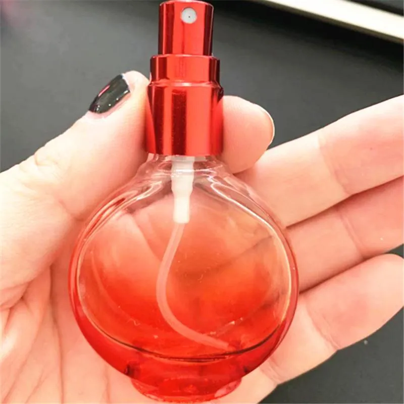 Commercio all'ingrosso Bottiglia di profumo in vetro da 15 ml Nebulizzazione fine Pressa portatile Piccola rotonda colorata