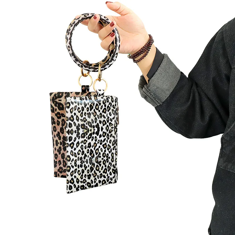 PU Keychain Monederos Pulsera Bolsa de bolsillo Mujer Tasel de cuero Diseñadores colgantes Bolsos de mano Leopardo de girasol estampados de damas Bag2470