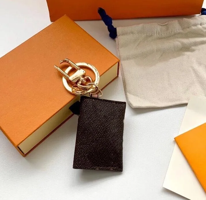 Luxury designer Keychain Keyring Fashion Purse Pendant Car Chain Charm Brown Flower Mini Bag Trinket Gifts Accessories306m