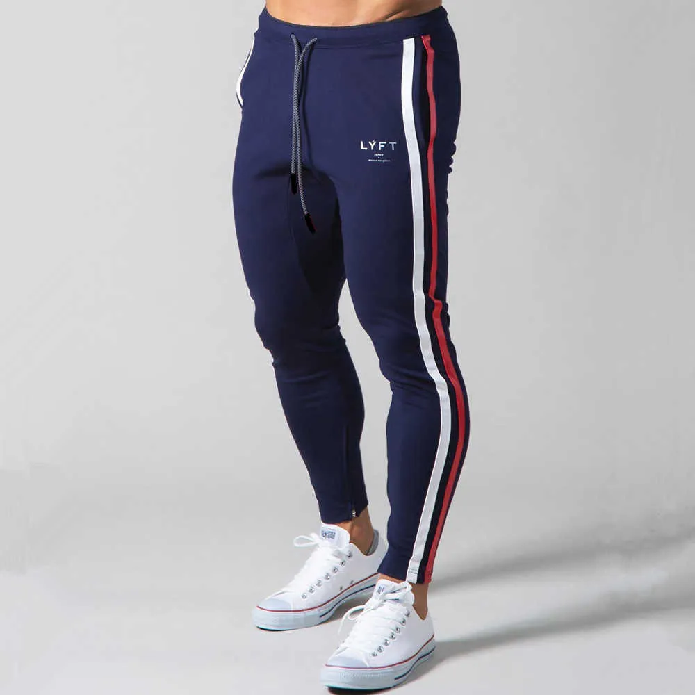 Białe jogger dresspants Men swobodne chude bawełniane spodnie siłowni trening fitness Spodnie męskie Spring Sportswear Pants P08245T