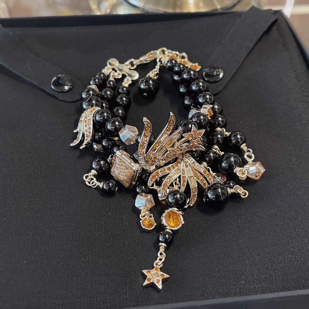 2021 marca gioielli di moda donna perle gioielli feste perline di cristallo nero spettacolo di primavera design stella gialla fiocco di neve di lusso6391243
