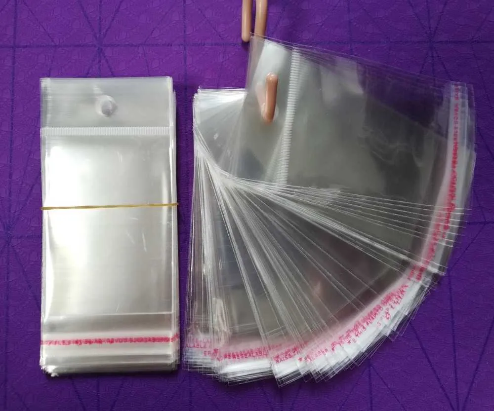 mycket klart självhäftande tätningsplastpåsar transparent återförslutningsbar cellofan poly packing väskor opp väska med hängande hål T2217R