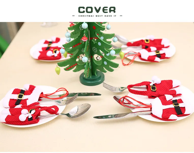クリスマステーブルの装飾クリスマスナイフとフォーククリスマスの服やズボンでの食事を設定