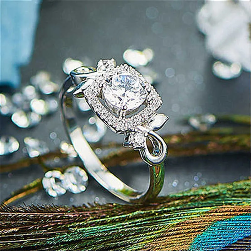 女性の輪の宝石類の宝石類のシルバーリングの魅力的な花を開く魅力的な花を開くダイヤモンドの結婚式のクラスターのための女性バンドのスタイル