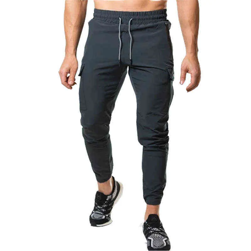 Nuovi pantaloni da jogging Tuta da uomo Pantaloni skinny casual Pantaloni multi-tasca Pantaloni da pista da uomo Palestra Allenamento fitness Bodybuilding Pantalone sportivo G0104