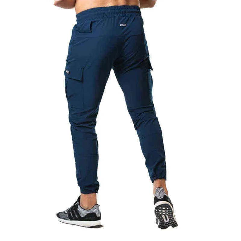 Nuovi pantaloni da jogging Tuta da uomo Pantaloni skinny casual Pantaloni multi-tasca Pantaloni da pista da uomo Palestra Allenamento fitness Bodybuilding Pantalone sportivo G0104