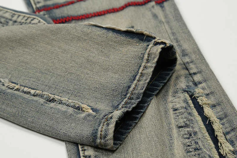 Jeans Uomo Jeans high street patchwork traforato con filo rosso ricamato