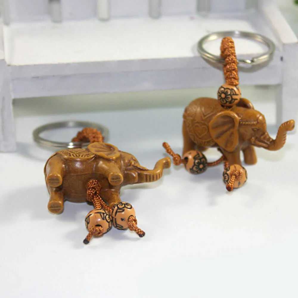 Porte-clés éléphant en acier inoxydable, 1 pièce, sculpture sur bois de pêche, Unique pour offrir des cadeaux, Pom mignon, G1019