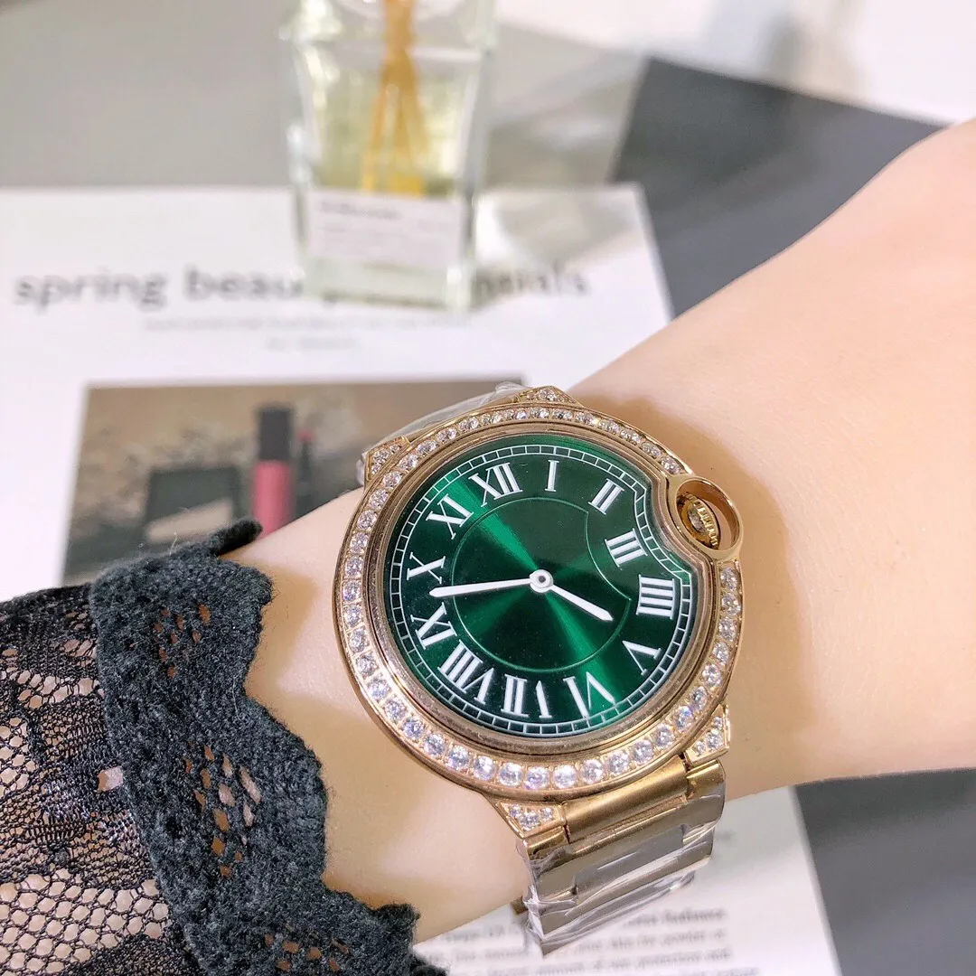 ファッションブランドの幾何学的ローマ数の腕時計の女性のステンレス鋼ラインストーンクォーツ時計緑色のダイヤル女性時計36mm