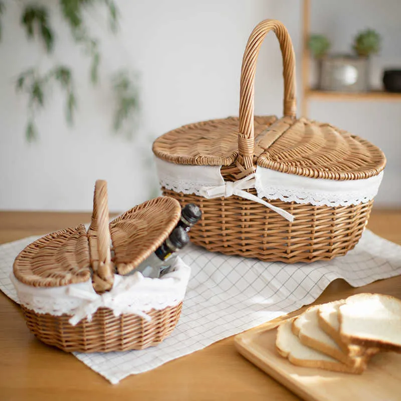 ハンドルと二重のふたが付いている枝編み細工品の手作りの藤のバスケット210609のためのピクニック食品収納容器