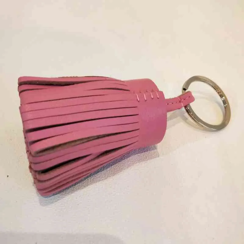 Beroemde merkontwerper Luxe echt lamsvacht echt leer kwastje sleutelhanger hanger sleutelhanger voor vrouwen meisjes tas Charm5076053