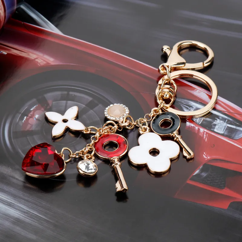 Kreatywne proste czterLEAF Clover Bierek Klapeink Key Chain Key Key Pierścień kobiecy torba Urok wisiorek mody mody mody bluchy 7535880