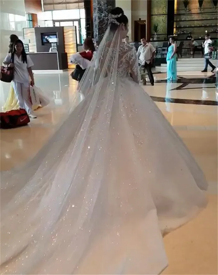 One pcs Luxurious Beadings Appliques Ball Gown Wedding Dresses 2022 Sexy Sheer Long Sleeves Beads Ruched Long Train Bridal Gowns