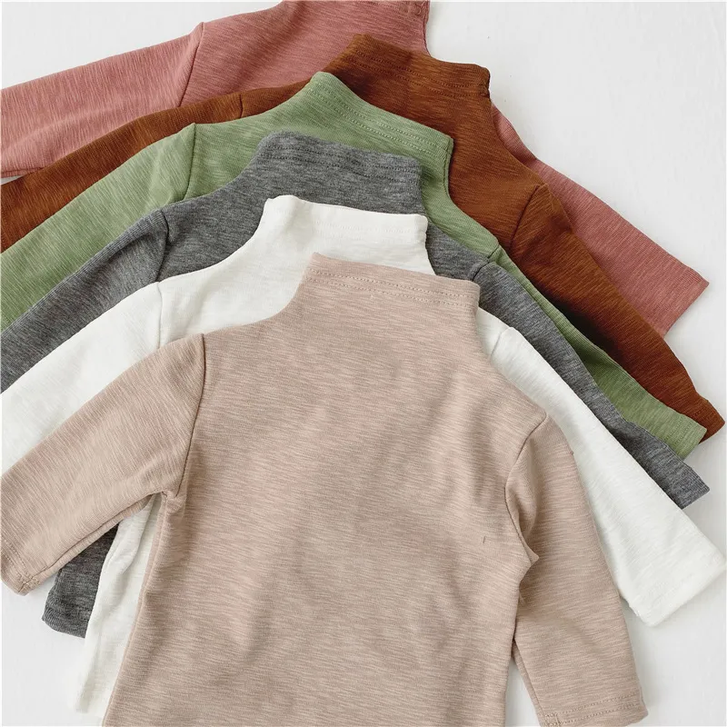 Koreansk version av spädbarn Solid Färg Höghalsad långärmad T-shirt Stretch Shirt Baby Kläder 210515