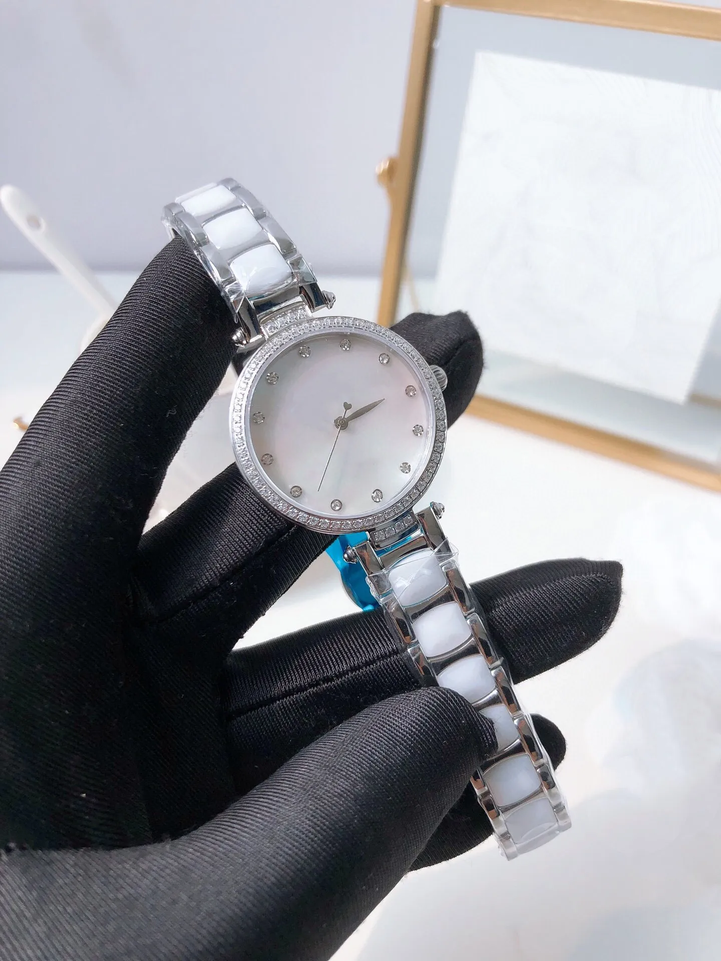 Mode nacre cadran conception bracelet en céramique blanche montre pour femmes horloge à quartz argent en acier inoxydable céramique montre-bracelet 33mm