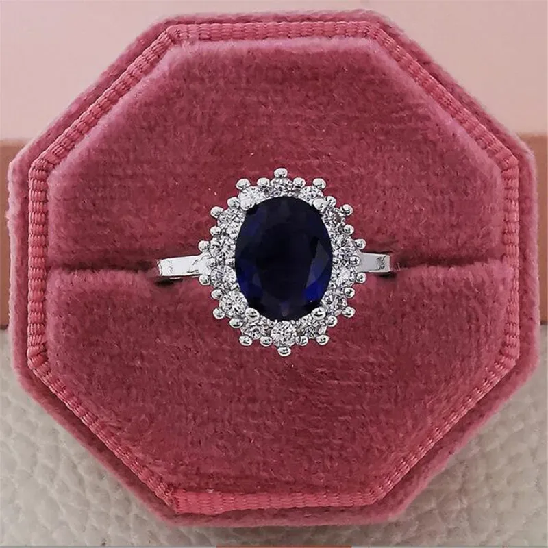 Ins top vender anéis de casamento simples moda jóias 925 prata esterlina oval corte azul safira pedras preciosas esmeralda cz diamante festa wo1927