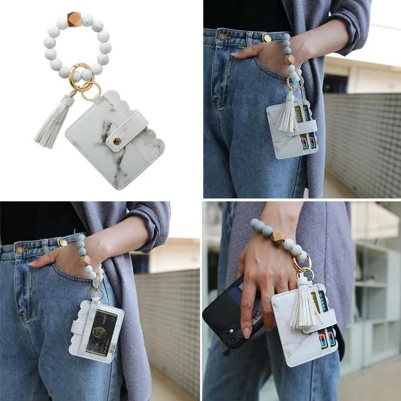 Armband Schlüsselanhänger Silikon Perlenarmband Leder Quaste Geldbörse Armreif X6HE G1019