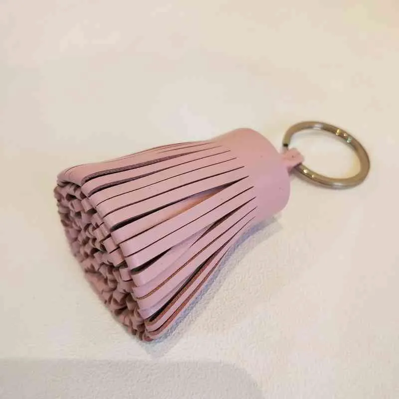 Beroemde merkontwerper Luxe echt lamsvacht echt leer kwastje sleutelhanger hanger sleutelhanger voor vrouwen meisjes tas Charm5076053