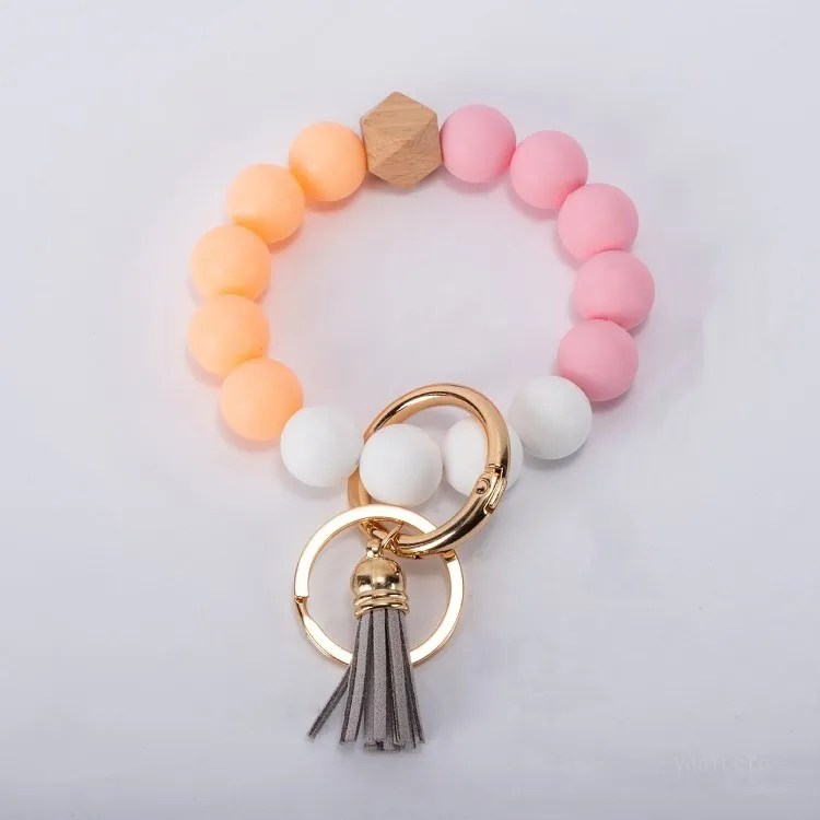 Articles de fête 9styles glands porte-clés en perles de bois Bracelet en perles de silicone Porte-clés en cuir Silicium de qualité alimentaire Poignet Porte-clés Pendentif Euramerican T2I52003