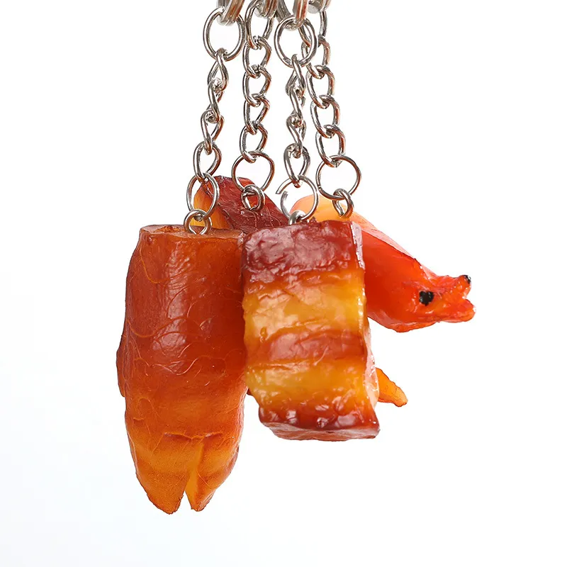 Key Creative Fashion Food Braised Pork KeyChain Pigs Fötter Kycklingvingar Modell Key Chain Car Bag Keyring Pendant Små gåvor NE3446868