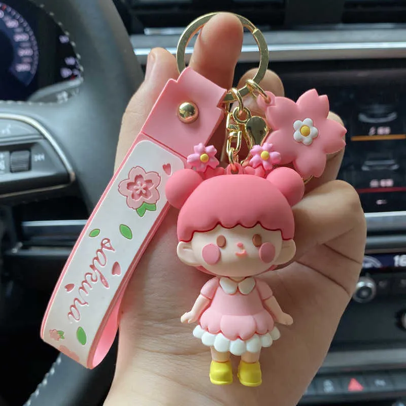 Nouveau rose fleur de cerisier fille porte-clés fille mignonne exquis sac à dos pendentif en trois dimensions dessin animé voiture porte-clés cadeaux en gros G1019