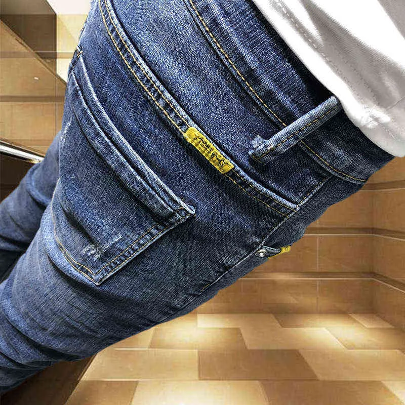 Оптовая мода вскользь студенты социальный дух парень личности тощий джинсы мужчины модный мужской бренд тонкие ноги брюки колготки 211103