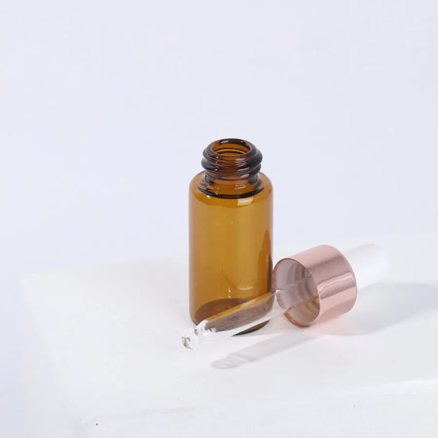 1ml 2ml 3ml Small Amber Glass Dropperflaskor Flaskor med Rose Gold Cap Essential Oil Perfume E Liquid Bottle Contianer