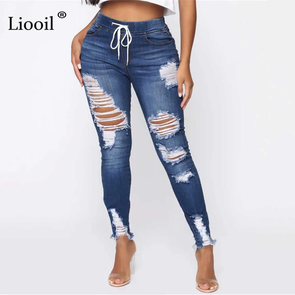 Pantalones vaqueros rasgados de color azul claro para mujer Estilo callejero Pantalones de lápiz de mezclilla con agujeros ajustados y tiro medio sexy 210715