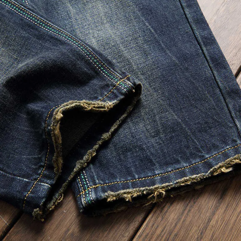 Jeans de marque de haute qualité Pantalons en denim en détresse Jeunes Ripped Hip Hop Street Street Ripped Straight Long Jeans X0621