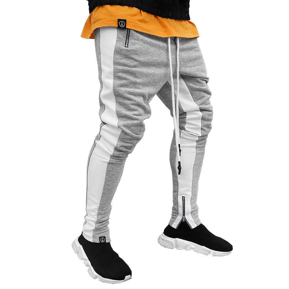 Män sida Stripe Fashion Pocket Byxor Casual Streetwear Jogger Pant Hip Hop Zipper Bottom Male Pencil Byxor Utomhus Sport Byxa 210714