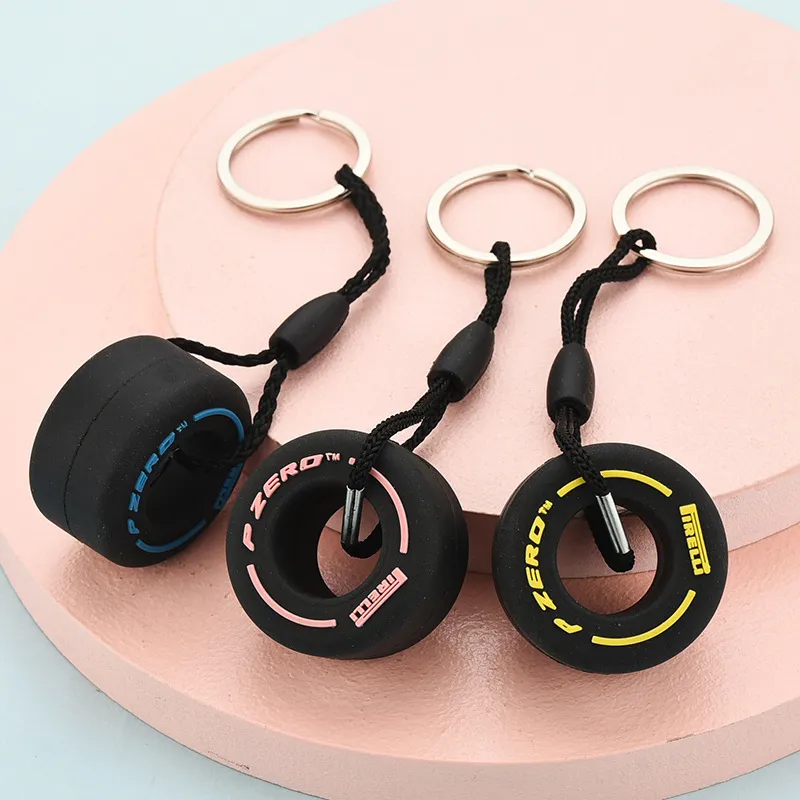 PVC Soft Rubber Tire KeyChain Silicone F1 Mini Söt däckbil Key Rings Bag dragkedja dekoration charms gåvor för unisex y04144778009