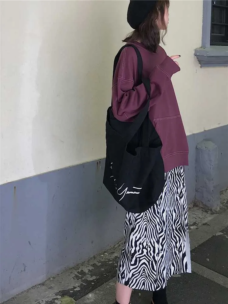 WERUERUYU Femmes Zebra Imprimer Jupe tricotée Coupe droite Taille élastique Dos Split Longueur Midi Vintage Dames Tenues 210730