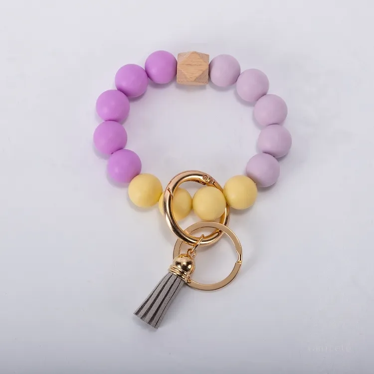 Articles de fête 9styles glands porte-clés en perles de bois Bracelet en perles de silicone Porte-clés en cuir Silicium de qualité alimentaire Poignet Porte-clés Pendentif Euramerican T2I52003