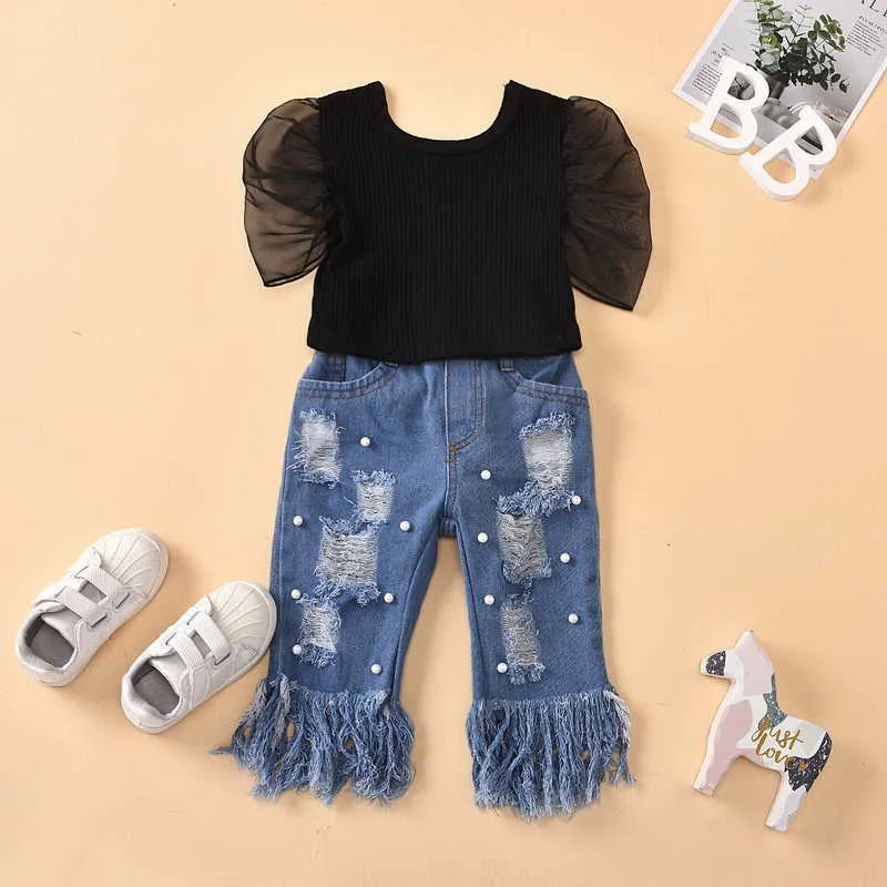 Wholesale летняя девушка 2 шт. Устанавливает черный слойки с короткими рукавами рубашки + отверстие кисточка жемчужные джинсы детские наряды E1789 210610