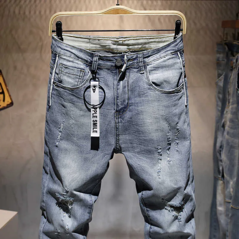 Мужчины разорвали повседневные джинсовые брюки модные бренд Man Streetwear Письмо Печатная дыра с серыми джинсовыми штанами 210719