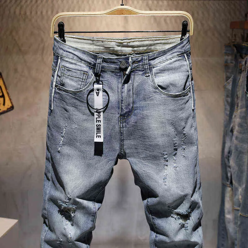 Pantaloni jeans skinny casual strappati da uomo Pantaloni di marca uomo streetwear Lettera stampata in difficoltà Pantaloni in denim grigio foro 211111