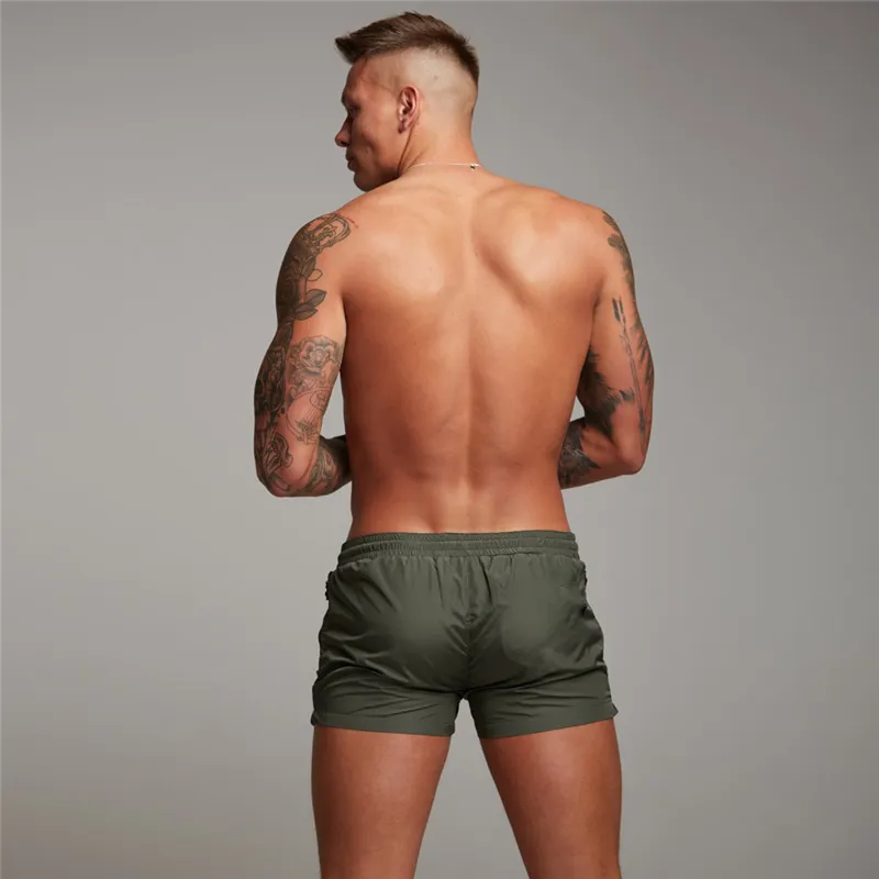 Haute qualité séchage rapide hommes Shorts été plage mode poche fermeture éclair musculation Fitness pantalons courts gymnases survêtement Shorts 210421