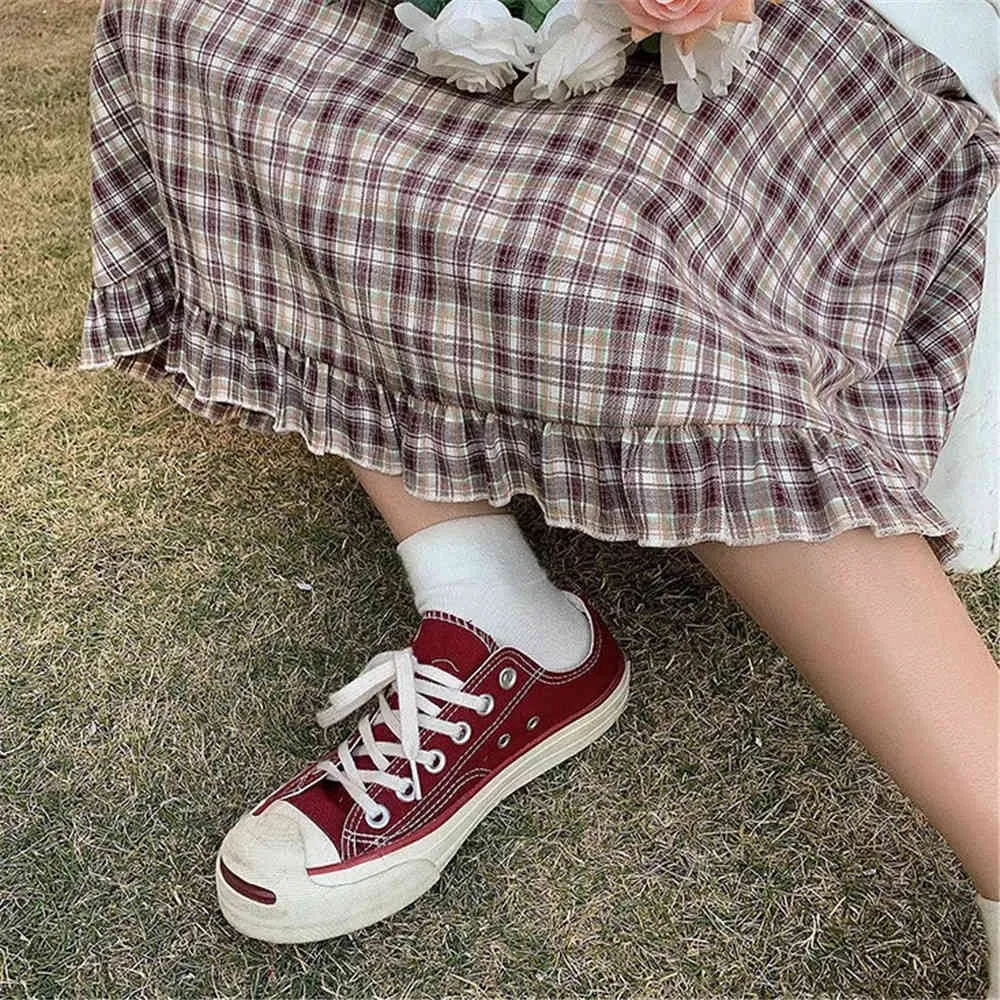 Femmes Taille élastique Plaid Jupes plissées Rouge Noir Solide Style coréen Sweet Girls School Students Slim All-Match Long 210421