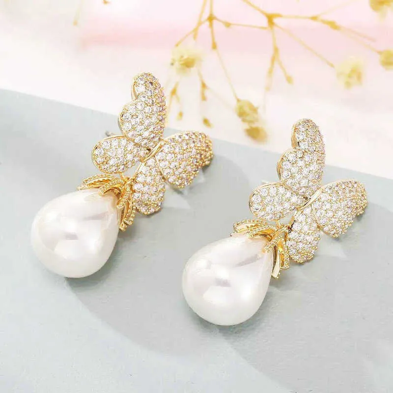 SINZRY splendida perla simulata zircone cubico farfalla fiore accessorio di gioielli alla moda orecchini pendenti le donne 210624247D