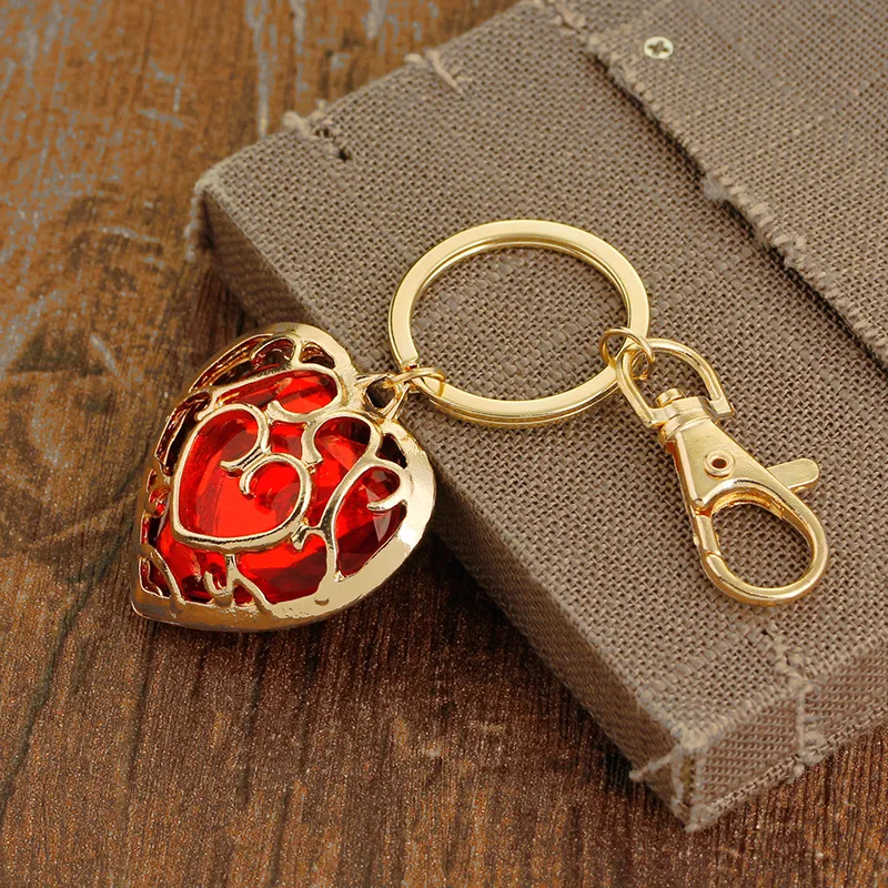 Creativo Zelda Legend Hollow Heart Llaveros Metal Car Bag Charm Bag llavero Niños Juguete para regalo Colgante llavero