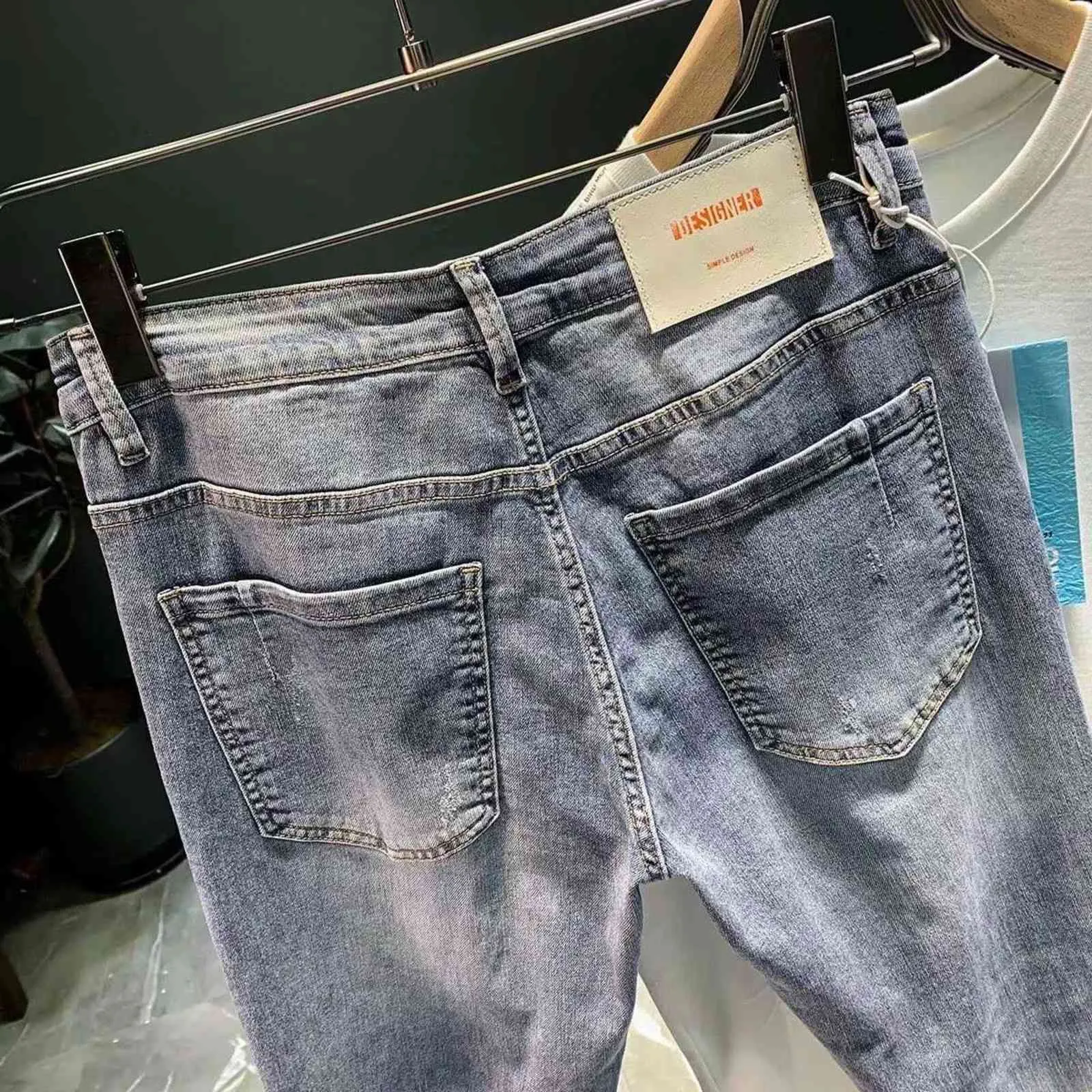 Déchiré Denim jeans hommes à la mode marque lâche été mince élastique pieds pantalon coréen harem adolescents recadrée 211108