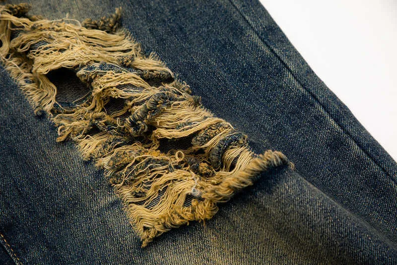 メンズジーンズハイストリート風の重工業は、洗った穴のまっすぐなジーンズを使用しました
