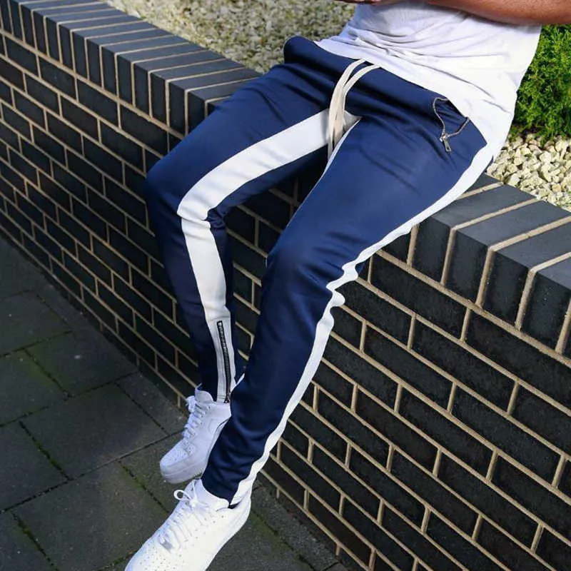 Pantaloni sportivi a righe Pantaloni da jogging hip-hop da uomo uomo donna Streetwear Pantaloni a tinta unita con cerniera a blocchi di colore Pantaloni slim fit 210715