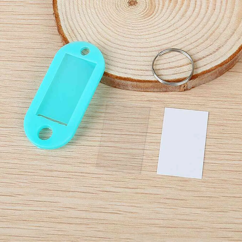 Hela 100st Mix Color Plastic KeyChain Key Taggar ID Etikett Namn Taggar med delad ring för bagage -nyckelkedjor nyckelringar 210409251H