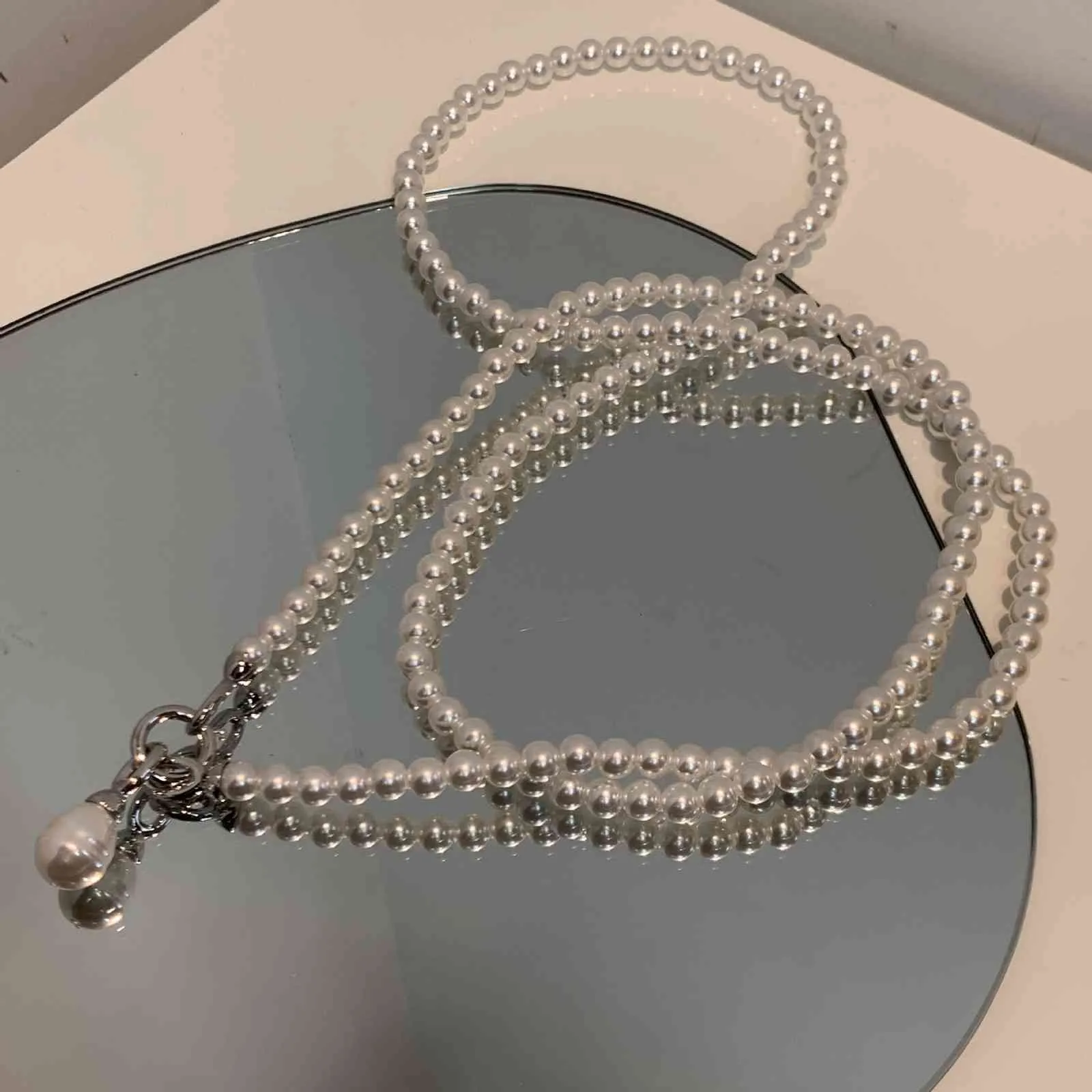 Modny design niszowy awangardowy korpus perłowy naszyjnik z wisiorkiem garnitur Crossbody prosty łańcuszek ozdobny